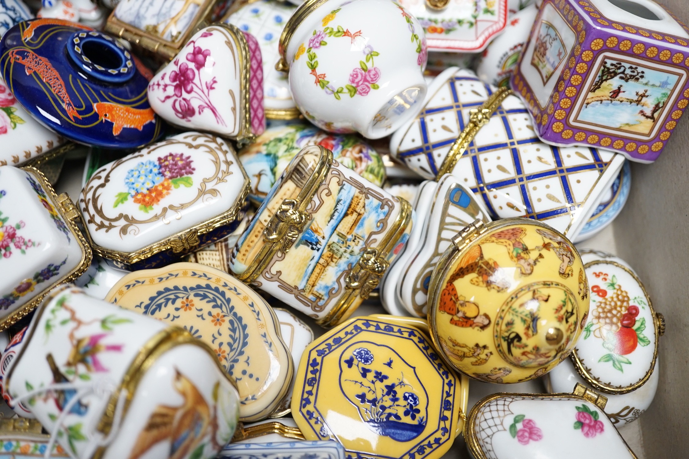 A quantity of approximately sixty Del Prado oriental and classic collection porcelain boxes, together with accompanying book and ephemera